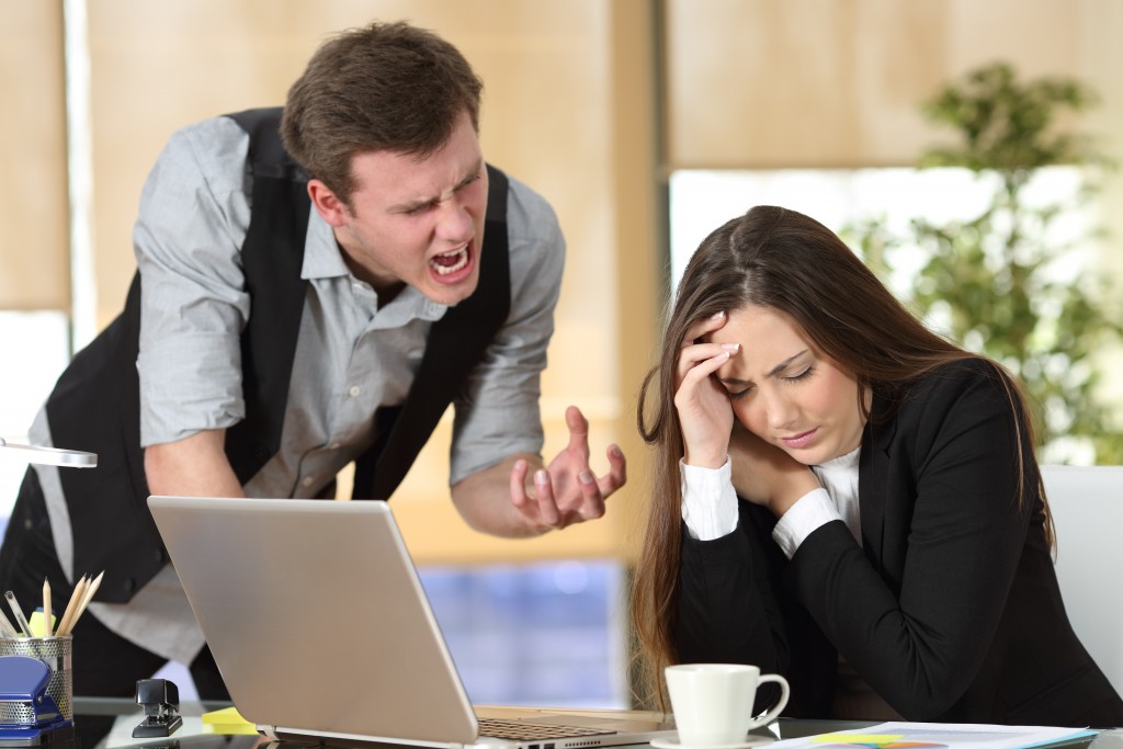 woman feeling stressed at her boss