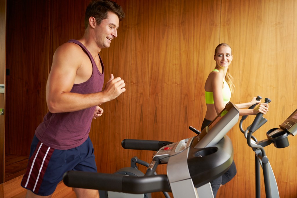 couple working out treadmill