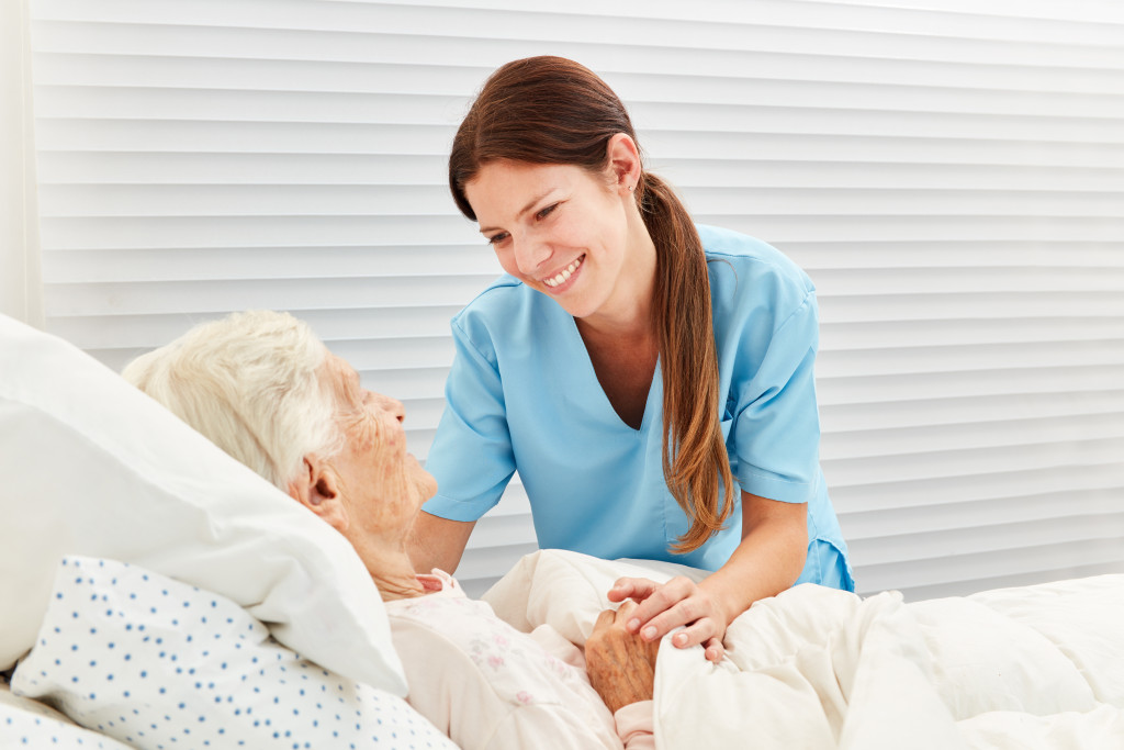 A hospice nurse caring for an elderly